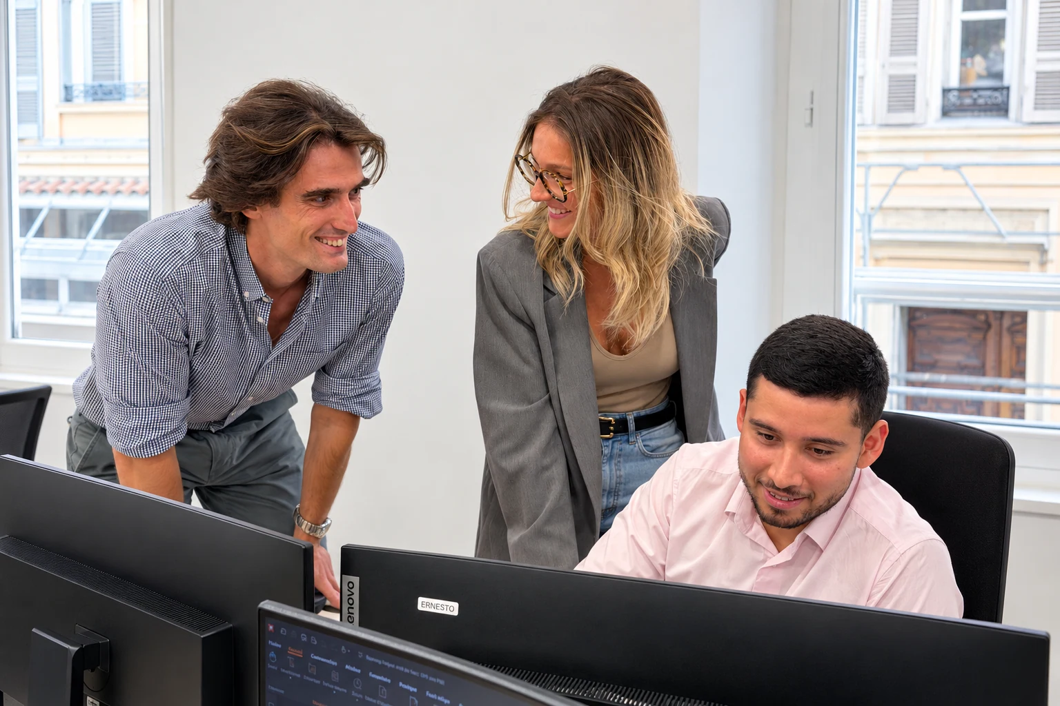 Nautilus Dynamics colleagues discussing technical reference material