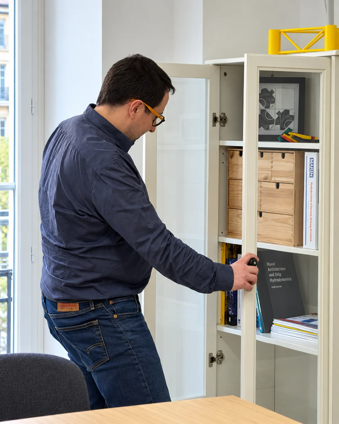 A Nautilus Dynamics colleague consulting the technical library